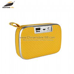 Portable yellow mini buletooth speaker looks like a wallet